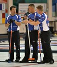 From left, Dave Nedohin, Ben Hebert and Marc Kennedy of Kevin Martin's rink take a break during a game in The Shoot-Out bonspiel at the Saville Community Sports Centre on Sept. 13, 2013.