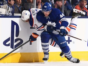 Morgan Rielly #44 of the Toronto Maple Leafs runs into Ales Hemsky #83 of the Edmonton Oilers during NHL action at the Air Canada Centre October 12, 2013 in Toronto.