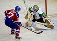 Edmonton Oil Kings Curtis Lazar (left) scored on this penalty shot against Prince Albert Raiders goalie Cole Cheveldave (right) during second period WHL hockey action in Edmonton on October 15, 2013.