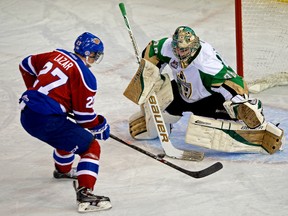 Edmonton Oil Kings Curtis Lazar (left) scored on this penalty shot against Prince Albert Raiders goalie Cole Cheveldave (right) during second period WHL hockey action in Edmonton on October 15, 2013.