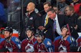 Patrick Roy, right, behind the bench of the Colorado Avalanche as head coach at Denver's Pepsi Center on October 4, 2013.