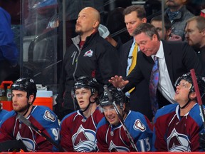 Patrick Roy, right, behind the bench of the Colorado Avalanche as head coach at Denver's Pepsi Center on October 4, 2013.