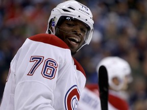 Montreal Canadiens' P.K. Subban laughs as he chirps Winnipeg Jets' Evander Kane during second period NHL hockey action in Winnipeg, Tuesday, October 15, 2013.