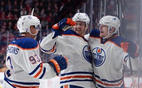 Oilers Ryan Nugent-Hopkins and Jeff Petry celebrate the game-tying goal by Ladi Smid (right) in Montreal. (Photo by Francois Lacasse/NHLI via Getty Images)