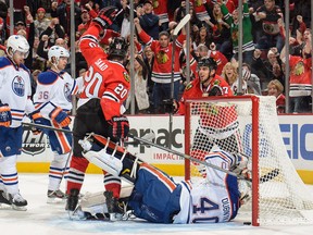 Anton Belov and Philip Larsen hang their heads after a Chicago goal. Photo: Bill Smith/Getty Images