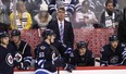 Claude Noel, head coach of the Winnipeg Jets, looks up to the replay in third period action in an NHL game against the Chicago Blackhawks at the MTS Centre on November 2, 2013 in Winnipeg.