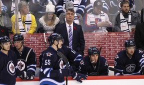 Claude Noel, head coach of the Winnipeg Jets, looks up to the replay in third period action in an NHL game against the Chicago Blackhawks at the MTS Centre on November 2, 2013 in Winnipeg.