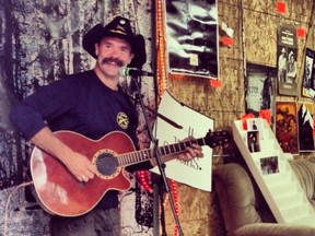 Serenading fans at his garage sale last year.