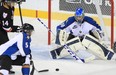 Kootenay Ice goalie Wyatt Hoflin keeps his eye on the puck against the Calgary Hitmen during their WHL game at the Saddledome in Calgary on Monday, Nov. 11, 2013.