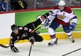 Calgary Hitmen left winger Jake Virtanen, left, flies through the air after colliding with Edmonton Oil Kings defenceman Griffin Reinhart during first period WHL action at the Scotiabank Saddledome on Nov. 3, 2013.