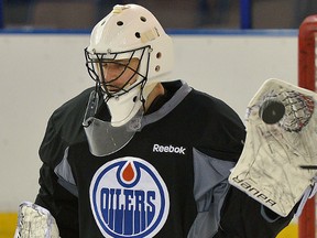 Edmonton Oilers goalie Ilya Bryzgalov faces shots in practice on Monday, Nov. 18, 2013.