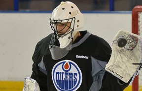 Edmonton Oilers goalie Ilya Bryzgalov faces shots in practice on Monday, Nov. 18, 2013.