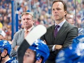 Head Coach Jon Cooper of the Tampa Bay Lightning on the bench during the third period against the Pittsburgh Penguins at the Tampa Bay Times Forum on October 12, 2013 in Tampa, Fla.