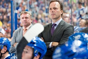 Head Coach Jon Cooper of the Tampa Bay Lightning on the bench during the third period against the Pittsburgh Penguins at the Tampa Bay Times Forum on October 12, 2013 in Tampa, Fla.