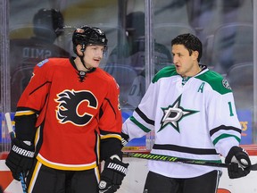 What's Shawn Horcoff saying to Ladi Smid? Write your own caption & include it in the comments. (Photo: Derek Leung/Getty Images North America)