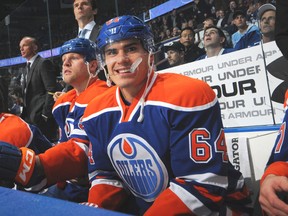 Nail Yakupov #64 of the Edmonton Oilers watches play from the bench during a game against the Toronto Maple Leafs on October 29, 2013 at Rexall Place in Edmonton.
