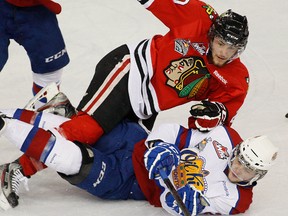 Edmonton Oil Martin Gernat is tripped up by Portland Winterhawks Taylor Leier during first period WHL playoff action at Rexall Place on May 12, 2013.
