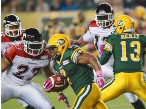 Edmonton Eskimos running back Hugh Charles runs the ball against the Calgary Stampeders in CFL action at Commonwealth Stadium in Edmonton on Friday, Oct. 18, 2013.
Photograph by: Ian Stewart, Edmonton Journal