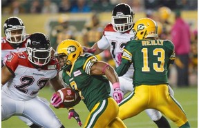 Edmonton Eskimos running back Hugh Charles runs the ball against the Calgary Stampeders in CFL action at Commonwealth Stadium in Edmonton on Friday, Oct. 18, 2013.
Photograph by: Ian Stewart, Edmonton Journal