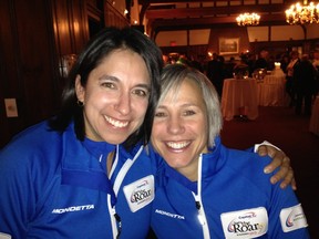 Grande Prairie skip Renee Sonnenberg and her lead, Rona Pasika from Edmonton, show off their new team outfits for the Capital One Road to the Roar Olympic curling pre-trials in the event's opening banquet on Monday at Kitchener, Ont.