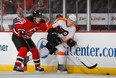 Rostislav Olesz battles with Flyers forward Michael Raffl. (Photo: Bruce Bennett/Getty Images)