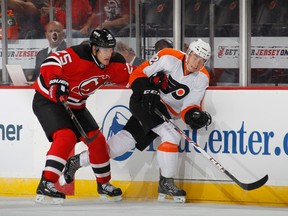 Rostislav Olesz battles with Flyers forward Michael Raffl. (Photo: Bruce Bennett/Getty Images)