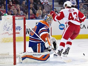 Detroit Red Wings Darren Helm (43) celebrates a goal on Edmonton Oilers goalie Richard Bachman (30) during first period NHL hockey action in Edmonton, Alta., on Saturday November 2, 2013. THE CANADIAN PRESS/Jason Franson