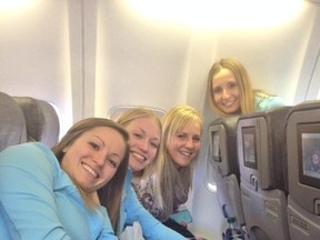 From left, Laura Crocker and her Saville Centre of rink of lead Jen Gates, second Rebecca Pattison and third Erin Carmody pose for a picture on the flight to Toronto earlier this week.