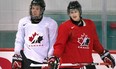 Team Canada hockey prospects Connor McDavid, left, and Nathan MacKinnon chat during Canada's National Junior Team training camp in Brossard, Que., Aug. 4, 2013.
