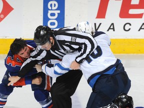 Nail Yakupov's bid for the Gordie Howe Hat Trick came up just short, as this set-to with Brian Little and several other Winnipeg Jets was interpreted to be a bunch of stick fouls, mostly by the frustrated visitors.