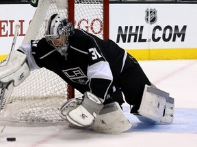 Los Angeles Kings goalie Martin Jones covers the puck during play against the Colorado Avalanche at L.A.’s Staples Center on Saturday, Dec. 21, 2013.