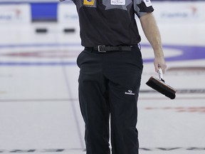 Skip Kevin Martin celebrates after making two points on his final shot to defeat Kevin Koe on Tuesday morning at the Tim Hortons Roar Of The Rings Canadian Olympic curling trials at the MTS Centre in Winnipeg.