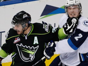 Edmonton Oil Kings Mitchell Moroz pushes Saskatoon Blades Ryan Coghlan out of his way during WHL action on Dec. 15, 2013 at Rexall Place.