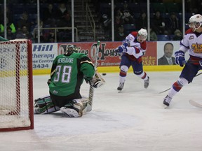 Edmonton Oil Kings forward Lane Bauer fires a snapshot past Prince Albert Raiders goalie Cole Cheveldave to put his team up 3-1 in a game during second period action at the Art Hauser Centre in Prince Albert on Wednesday, Dec. 11, 2013.