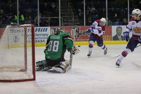 Edmonton Oil Kings forward Lane Bauer fires a snapshot past Prince Albert Raiders goalie Cole Cheveldave to put his team up 3-1 in a game during second period action at the Art Hauser Centre in Prince Albert on Wednesday, Dec. 11, 2013.