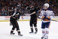 Corey Perry #10 and Dustin Penner #17 of the Anaheim Ducks celebrate Penner's third period goal, as Sam Gagner #89 of the Edmonton Oilers looks on Dec. 15, 2013, at Anaheim's Honda Center.