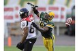 Calgary Stampeders' Nick Lewis misses a pass while Edmonton Eskimos' T.J. Hill covers him during the first half of their semi-final CFL football game in Calgary, Alberta, November 13, 2011.
Photograph by: Reuters, edmontonjournal.com