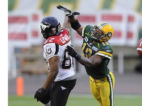 Calgary Stampeders' Nick Lewis misses a pass while Edmonton Eskimos' T.J. Hill covers him during the first half of their semi-final CFL football game in Calgary, Alberta, November 13, 2011.
Photograph by: Reuters, edmontonjournal.com