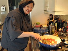 Valerie Rodgers Lugonja cooks up some game meat at a game-tasting lunch hosted at her home. She is a local foodie who has started a company giving cooking classes. Kevin Kossowan, a local blogger and game meat specialist, was also conducting the class on game meats. (See story by Liane Faulder) (Photo by Larry Wong/Edmonton Journal)