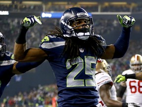 Cornerback Richard Sherman #25 of the Seattle Seahawks  celebrates after the 2014 NFC Championship game on January 19, 2014 in Seattle, Washington.  Photo by Jonathan Ferrey, Getty Images.