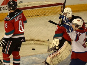 Edmonton oil Kings forward Brandon Baddock, right, celebrates a goal on Kelowna Rockets goalie Jordon Cooke during WHL action at rexall Place Wednesday, Jan. 8, 2014. The Oil Kings beat the visiting Rockets 4-2.