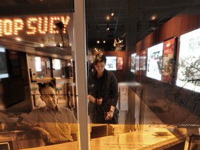 Kelsey Dalrymple checks out the new exhibit: Chop Suey On the Praries (A history of Chinese Restaurants in Alberta), at the Royal Alberta Museum in Edmonton. The show will run from Apr 20, 2013 until Apr 27, 2014. Photo by John Lucas/Edmonton Journal