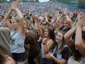 EDMONTON, ALBERTA: AUGUST 11, 2013 - Music fans dance to the music of The Avett Brothers at the main stage during the 2013 Edmonton Folk Music Festival on Sunday August 11, 2013. (PHOTO BY LARRY WONG/EDMONTON JOURNAL)