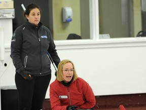Tiffany Game watches as Chana Martineau hollers instructions to her sweepers during the Northern Alberta Curling Association women's A Event final at the Crestwood Curling Club on Dec. 21, 2013.