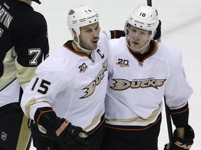 Ryan Getzlaf, left, celebrates his goal with teammate Corey Perry during a National Hockey League game against the Pittsburgh Penguins in Pittsburgh on Nov. 18, 2013.