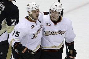 Ryan Getzlaf, left, celebrates his goal with teammate Corey Perry during a National Hockey League game against the Pittsburgh Penguins in Pittsburgh on Nov. 18, 2013.