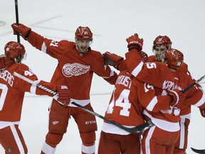 Detroit Red Wings left-winger Tomas Tatar (21) rushes in to celebrate the wacky goal by defenceman Niklas Kronwall (55) late om the third period of a National Hockey League game against the Los Angeles Kings iat Detroit on Jan. 18, 2014.