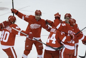 Detroit Red Wings left-winger Tomas Tatar (21) rushes in to celebrate the wacky goal by defenceman Niklas Kronwall (55) late om the third period of a National Hockey League game against the Los Angeles Kings iat Detroit on Jan. 18, 2014.