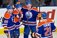 From left, Edmonton Oilers players Sam Gagner, Taylor Hall, Justin Schultz and Andrew Ference celebrate a goal against the Tampa Bay Lightning during  NHL action vs. the visiting Tampa Bay Lightning at Rexall Place on Jan. 5, 2014.