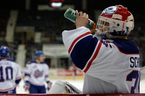 Regina Pats goalie Nick Schneider (#35) takes a drink during a game held at the Brandt Centre in Regina, Sask. on Wednesday, Jan. 1, 2014.